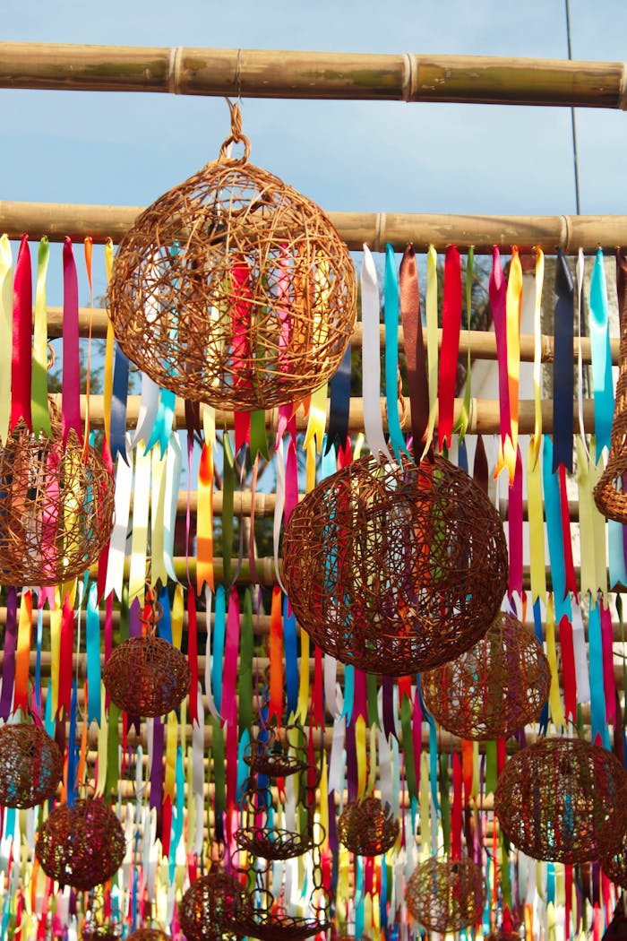 Home Vibrant wicker spheres and ribbons hanging in Tapijulapa's festive outdoor market.