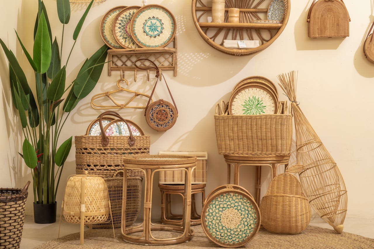 services-03 Cozy arrangement of wicker and rattan furniture with greenery indoors.